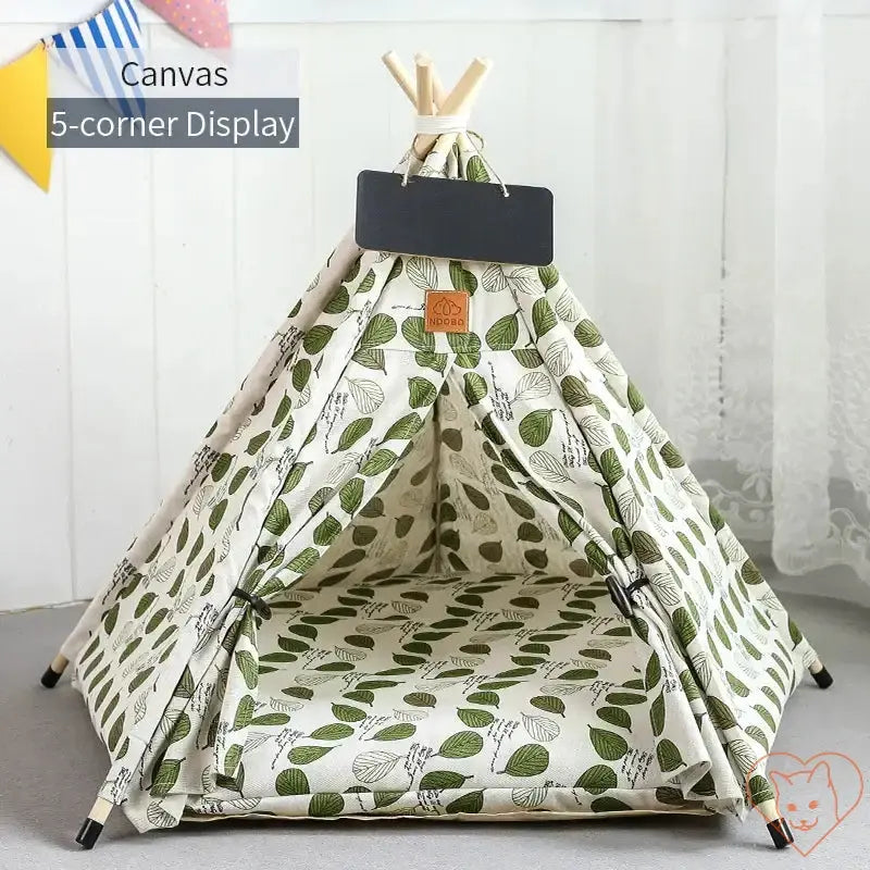 Cozy cat teepee tent with leafy design, sturdy wooden poles, and plush cushion for feline relaxation.