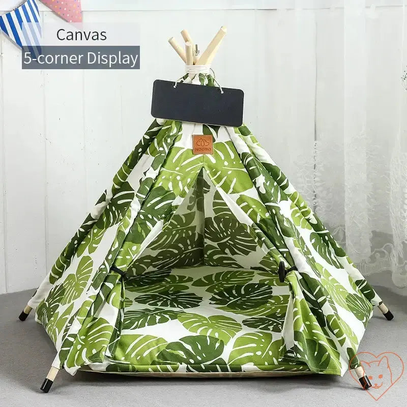Stylish Cat Teepee Tent with green leaf pattern, plush interior, and wooden poles for cozy feline retreats.