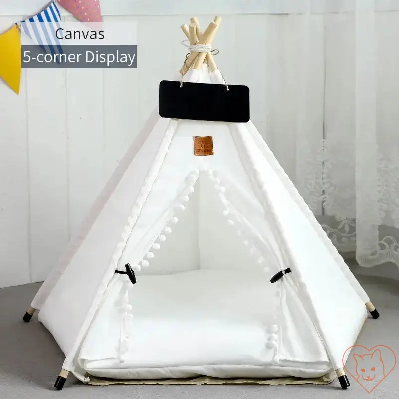 Cozy white cat teepee tent with plush cushion and pine wooden poles, perfect for feline relaxation.