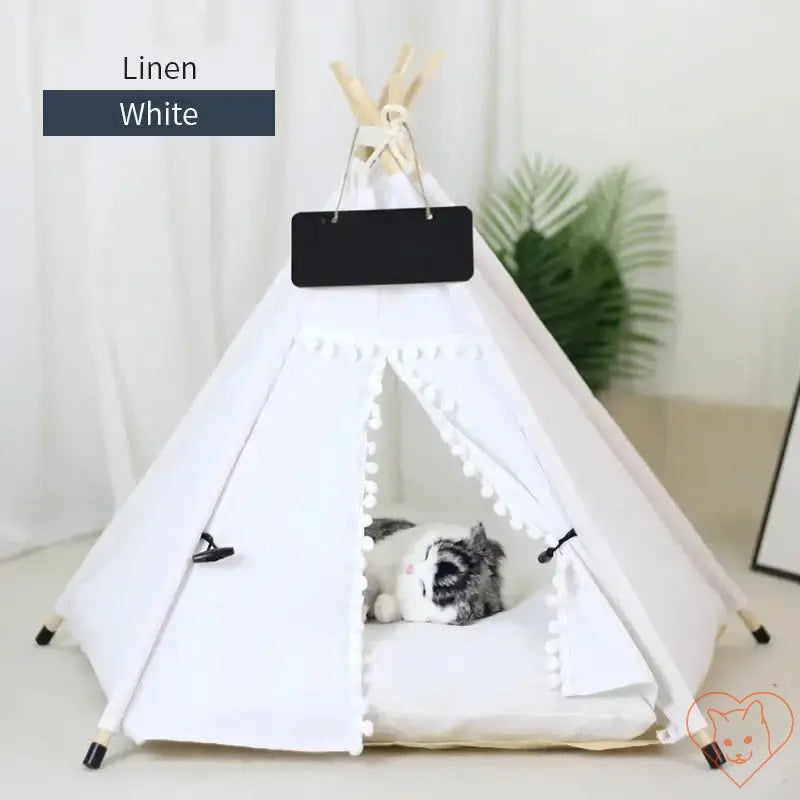 Cozy white linen cat teepee tent with plush cushion, perfect hideaway for cats.