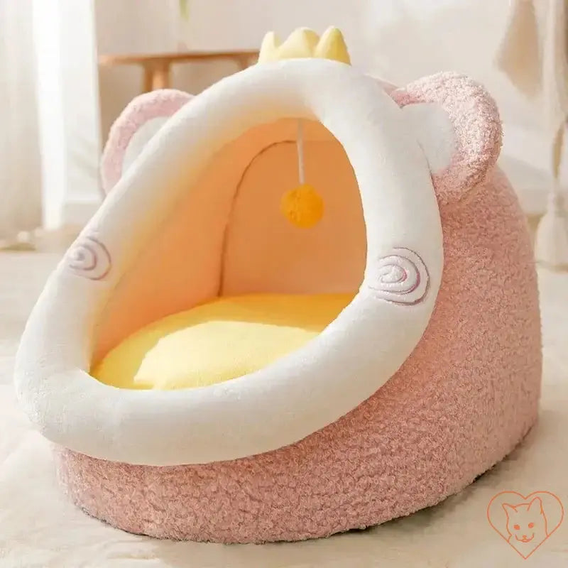 Semi-enclosed plush cat bed in pink, perfect for autumn and winter cuddle sessions.