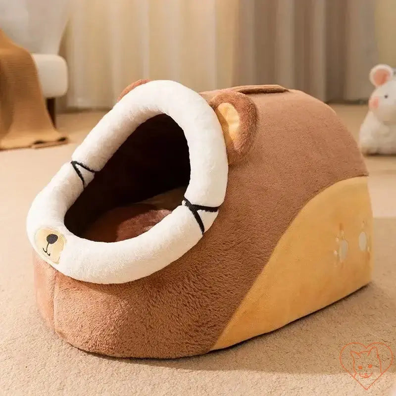 Semi-enclosed plush cat bed in warm brown color with a cute bear design, perfect for pet comfort in colder seasons.