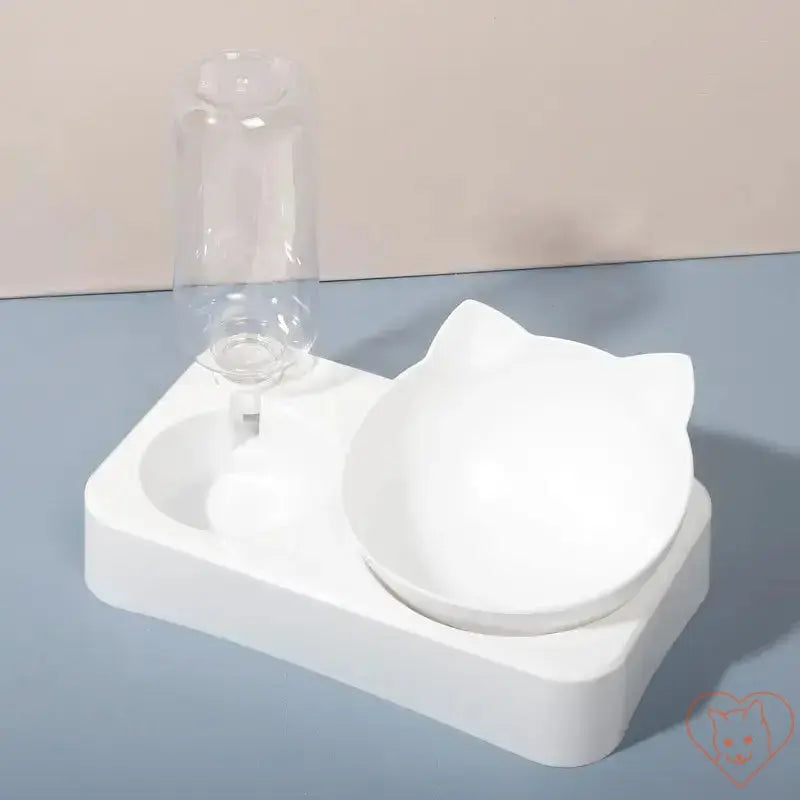 15° tilt cat bowl with automatic waterer in white. Ergonomic design for comfortable pet feeding and hydration.