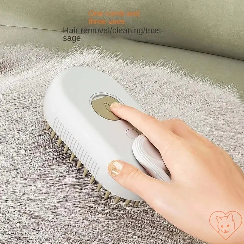 3-in-1 Cat Steam Brush in use for grooming, featuring hair removal, cleaning, and massage functions.