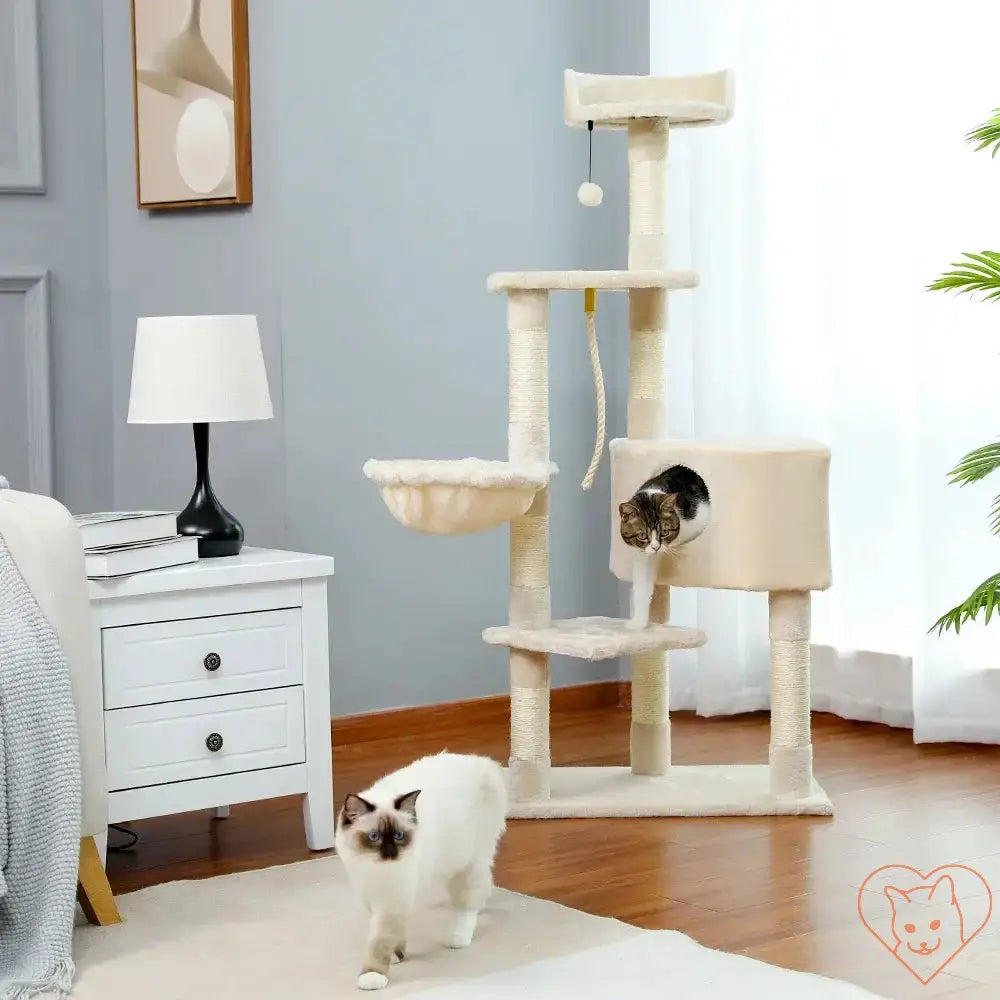 Two cats playing around a 68-inch multi-level cat tree tower with condos and sisal-covered posts.