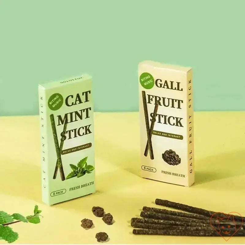 Two packs of cat mint and gall fruit sticks for fresh breath, placed next to natural chew sticks on a pastel background.