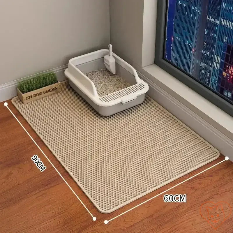 90x60CM waterproof cat litter mat beside litter box, featuring non-slip design for easy cleanup.