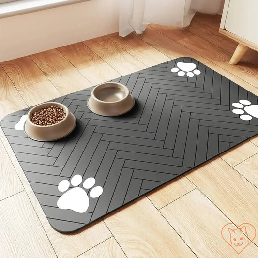 Absorbent pet feeding mat with paw prints, non-slip design, ideal for clean feeding areas for dogs and cats.