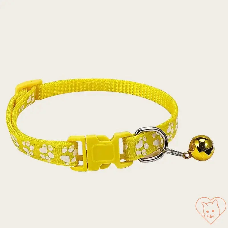 Adjustable yellow nylon pet collar with white paw prints and bell for small animals.