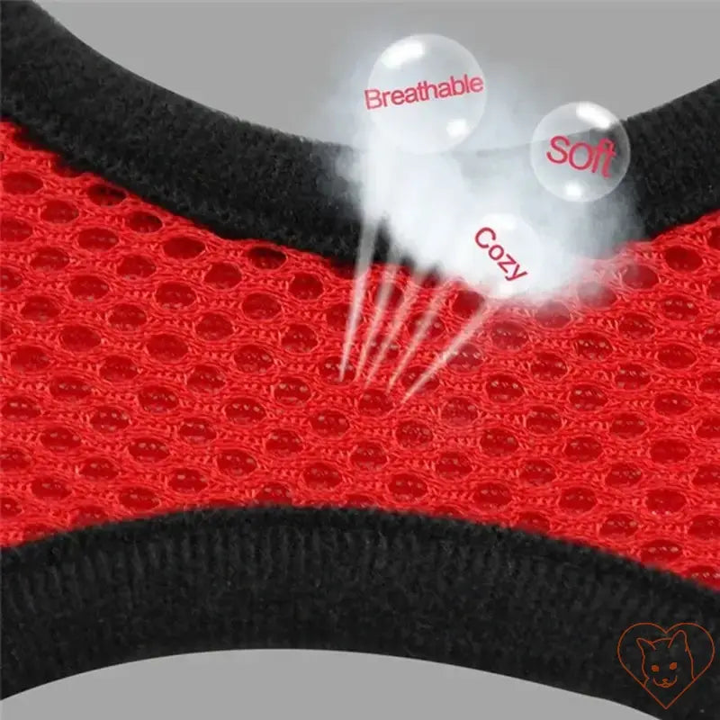 Close-up of breathable red polyester mesh fabric used in an adjustable cat harness, highlighting soft and cozy features.