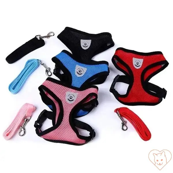 Adjustable reflective cat harnesses in various colors with leashes, made from breathable polyester mesh for comfort.