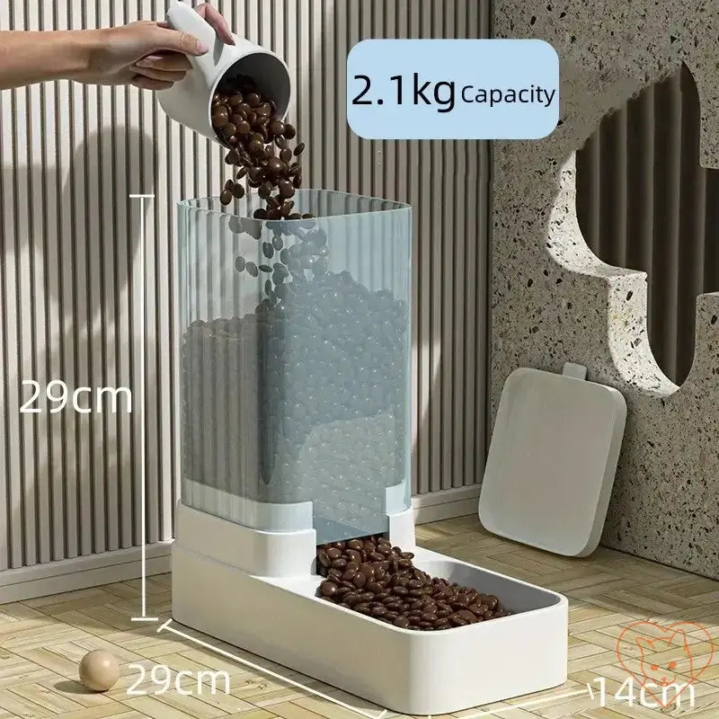 Automatic coffee bean dispenser with 2.1 kg capacity, pouring beans into a container, stylish storage solution.