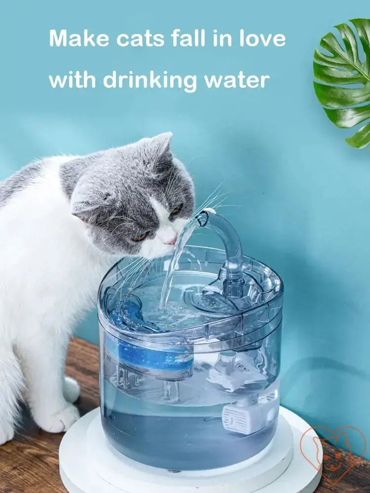 Cat enjoying the Automatic Cat Water Fountain, promoting hydration with fresh flowing water.