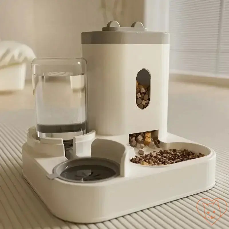 Automatic feeder and water fountain for pets with raised dish bowl and built-in water dispenser in a modern design.