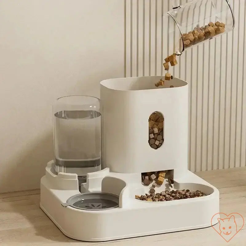 Automatic feeder and water fountain with raised stand, dispensing food and fresh water for cats and dogs.