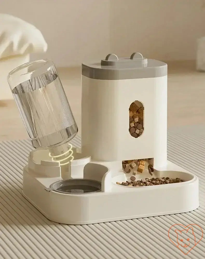 Automatic feeder and water fountain for pets with raised stand and large-capacity bowl in a modern design.