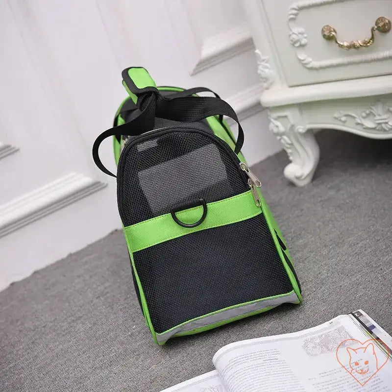 Breathable green pet travel bag with mesh sides, ideal for cats and dogs, showing comfortable design.