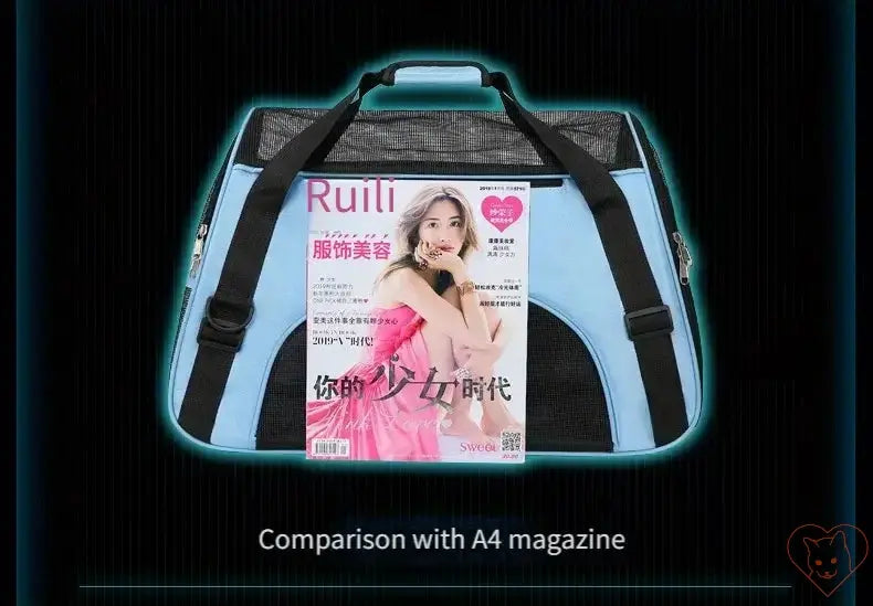 Breathable pet travel bag shown next to an A4 magazine for size comparison.