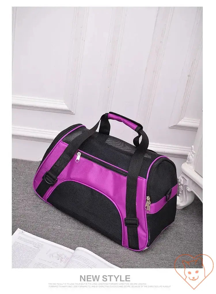 Breathable pet travel bag in purple and black, designed for cats and small dogs with four-sided mesh panels.