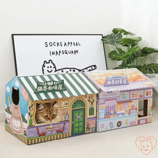 Cozy cat in an illustrated carton house with scratching board, perfect for entertainment and relaxation.