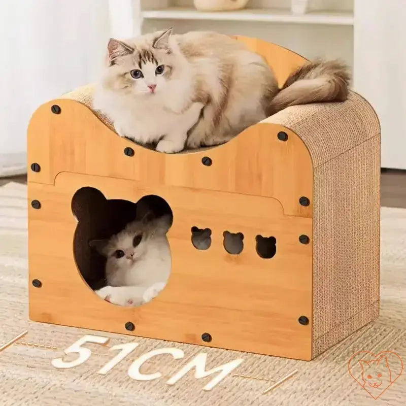 Two cats playing in a cozy wooden cat condo with a scratcher board and cave design, perfect for feline comfort and fun.