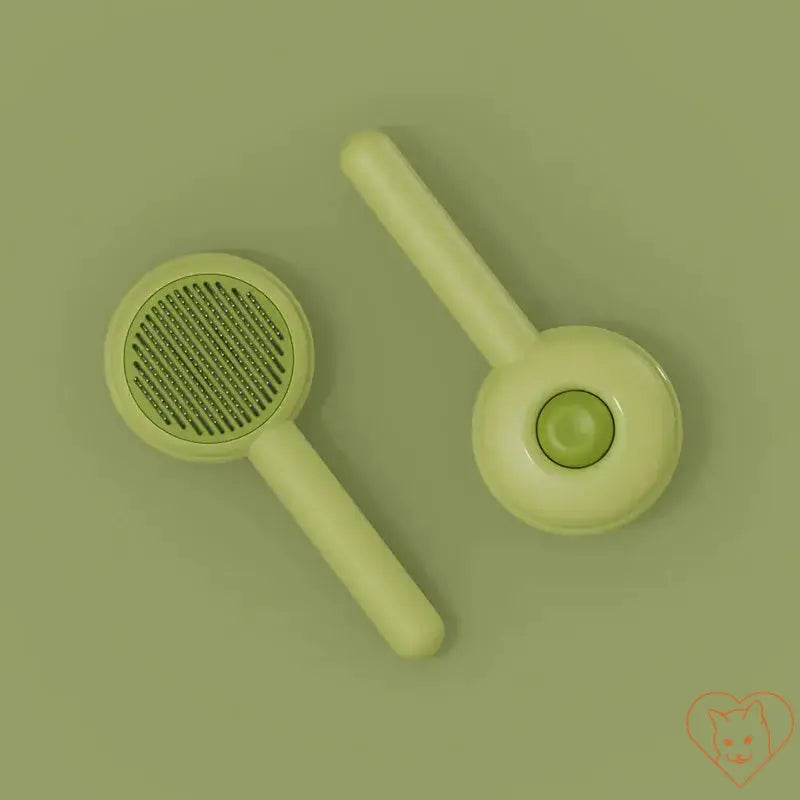 Cat Hair Removal Brush set on a green background, ideal for tangle-free grooming and effective fur removal.