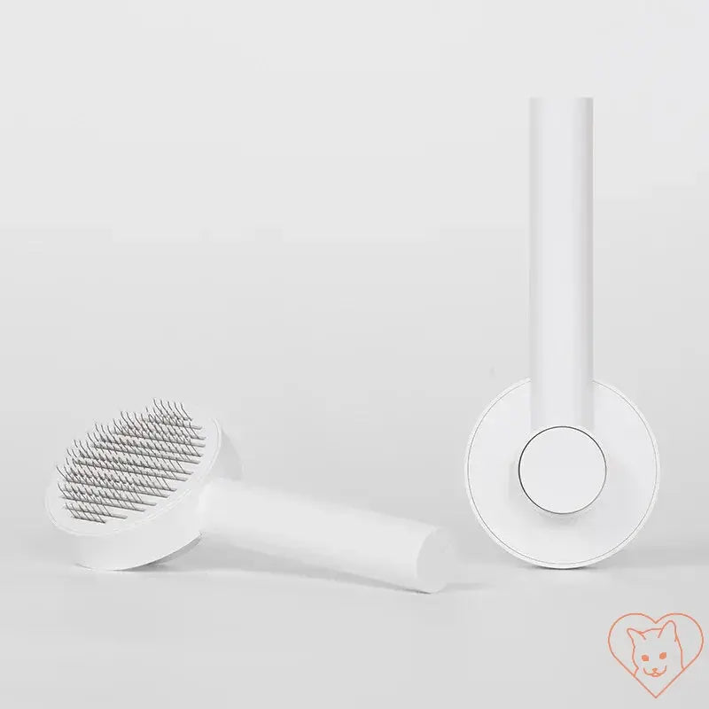 Cat hair removal brush in white, designed for tangle-free grooming and effective fur removal.