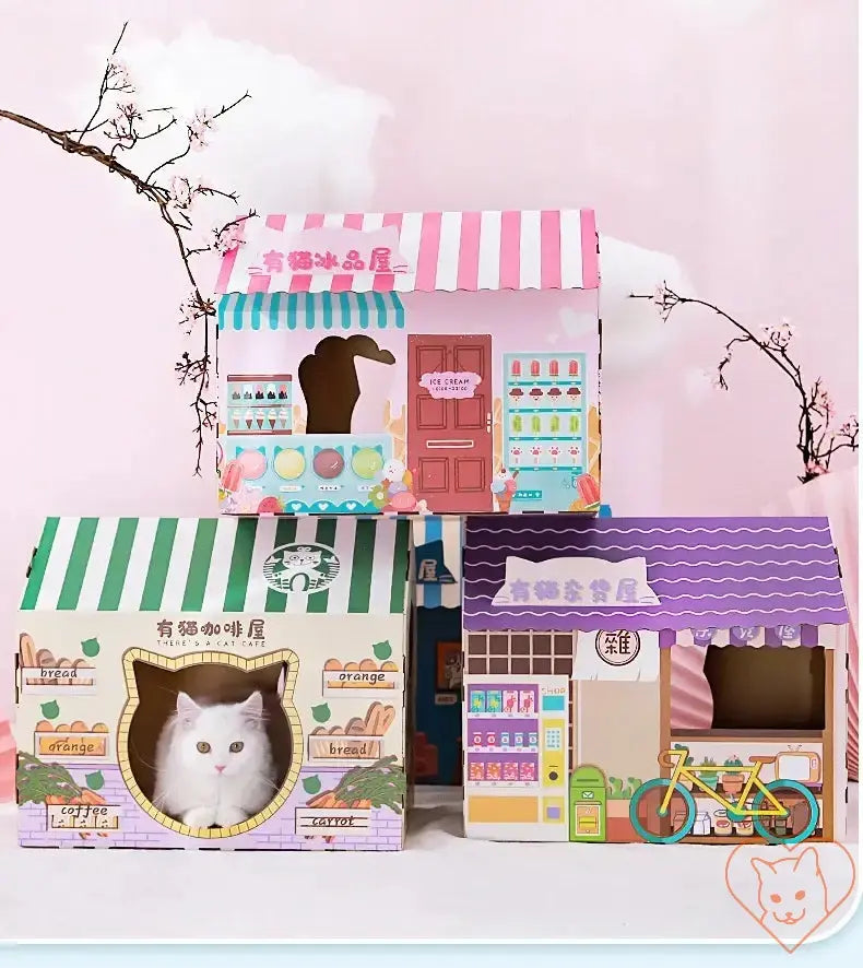 Colorful cardboard cat houses with playful designs, featuring a cozy resting spot for cats.