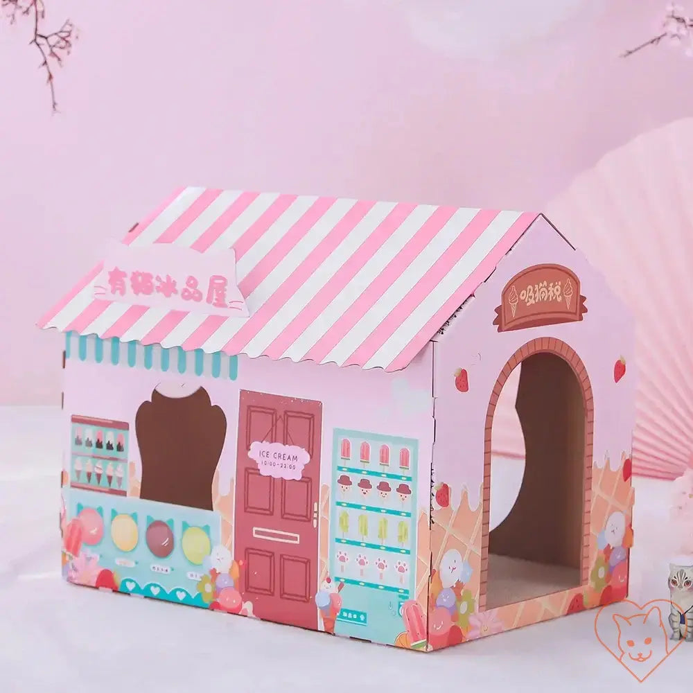 Colorful cardboard cat house designed like an ice cream shop with engaging play spaces and cozy entrances.