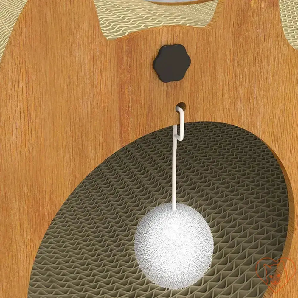 Close-up of a playful bobble hanging inside a Cat Scratcher Tunnel for indoor cats.