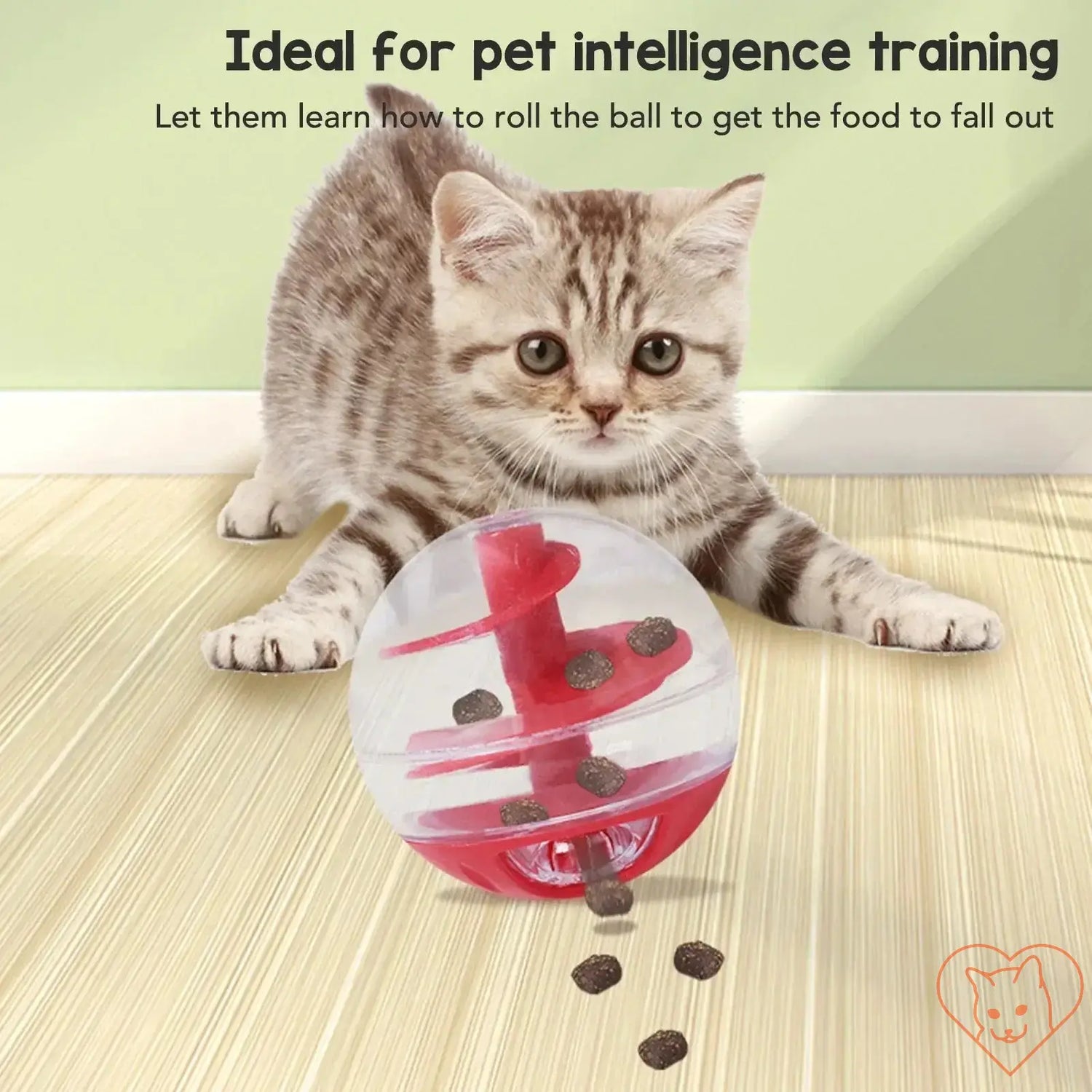 Cat playing with interactive treat dispensing ball, promoting intelligence and healthy eating habits.