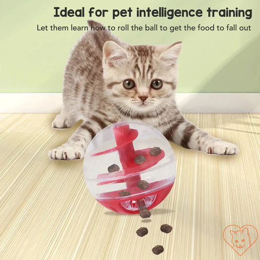 Cat playing with interactive treat dispensing ball, promoting intelligence and healthy eating habits.