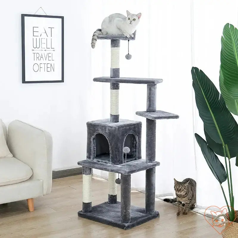 Multi-level cat tree house tower with scratching posts, featuring a cozy hammock and playful kittens.