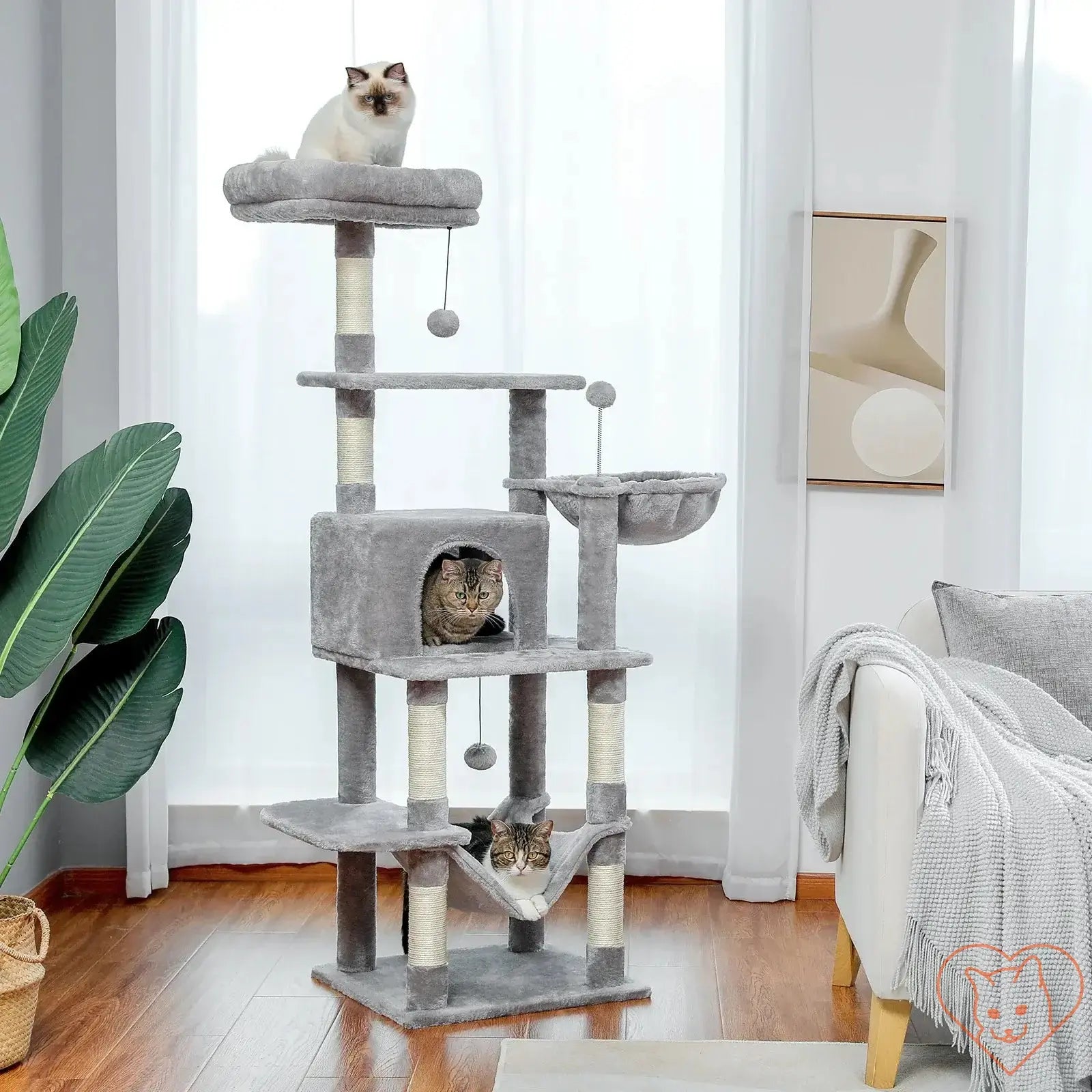 Cat Tree House Tower with multiple levels, scratching posts, and three cats playing inside and on top.