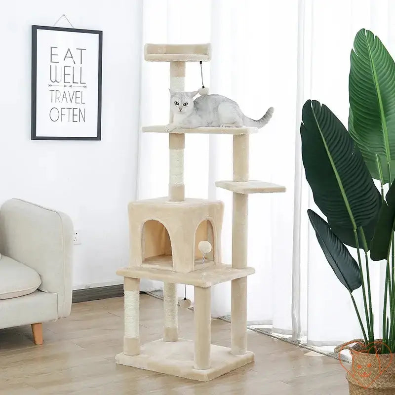 Cat tree house tower multi-level condo with a gray cat lounging on a tier and scratching posts.