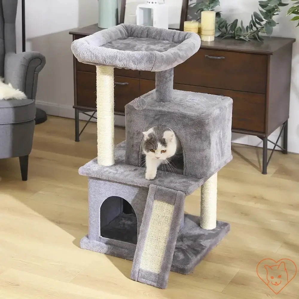 Cat Tree House Tower with multi-levels, scratching posts, and a hammock for cats.