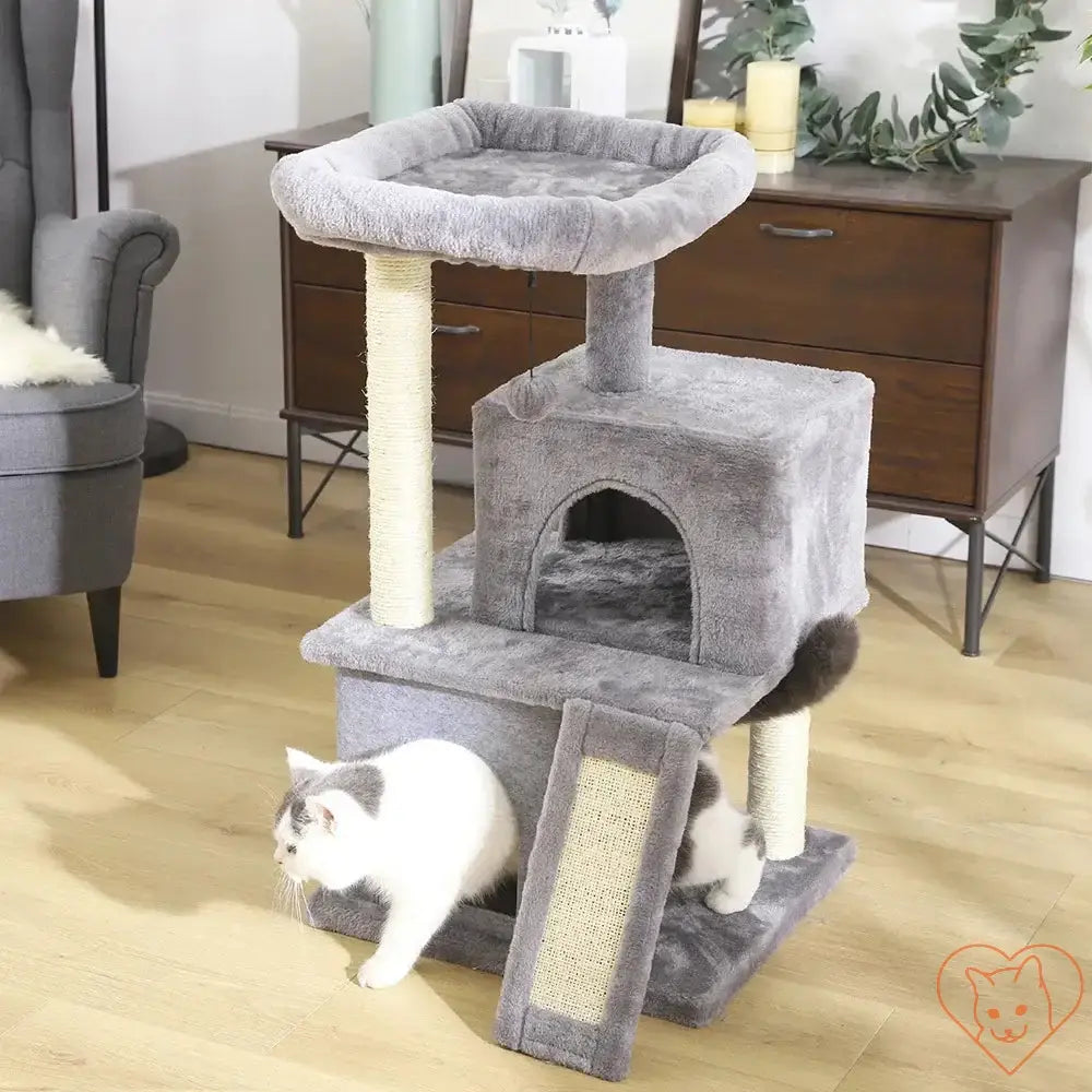 Multi-level cat tree house tower with scratching posts and a cozy hammock for playful felines.