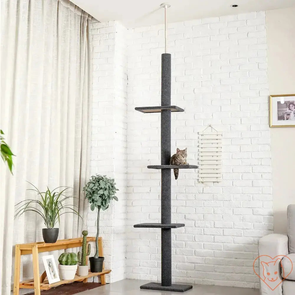 Cat tree house tower with multiple levels and a cat lounging on a shelf, perfect for climbing and scratching.