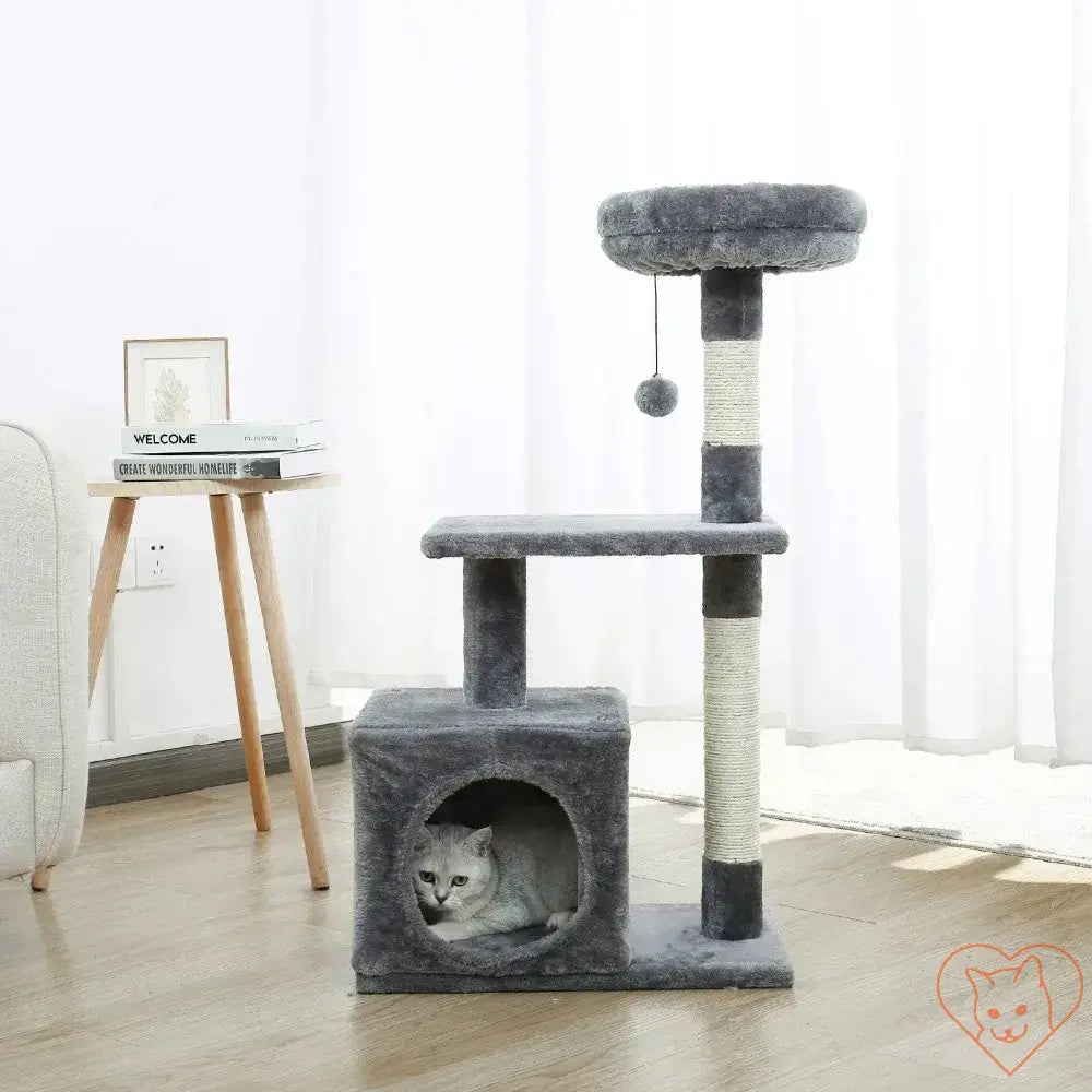 Gray multi-level cat tree house tower with scratching posts and a cozy hideaway for kittens.