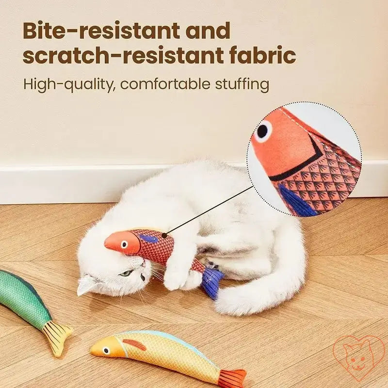 Cat playing with colorful fish toys made of bite-resistant and scratch-resistant fabric, showcasing comfort and durability.