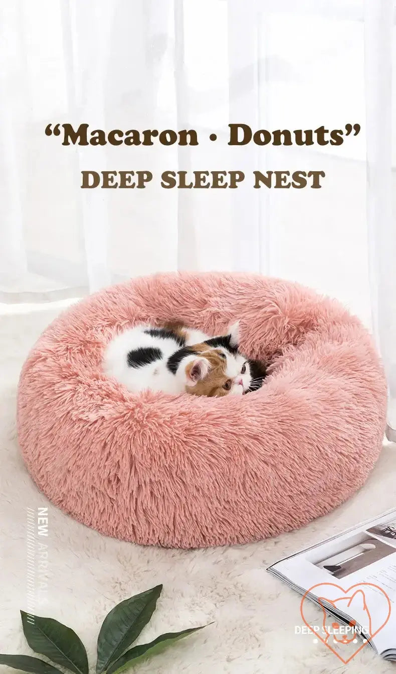 Cozy macaron-style cat bed with plush insulation for deep sleep, perfect for pets seeking comfort.