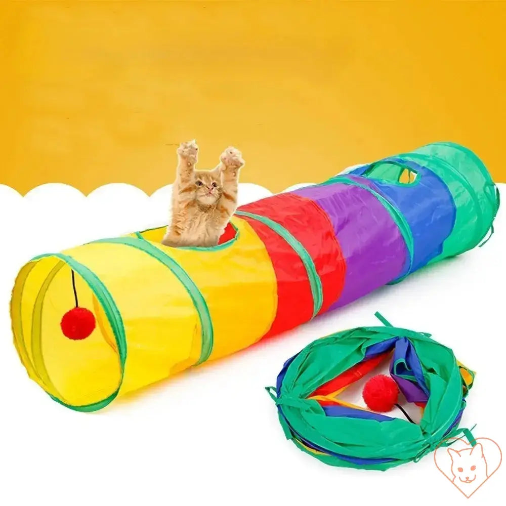 Colorful collapsible cat tunnel with a playful cat and attached pom-poms for indoor and outdoor fun.