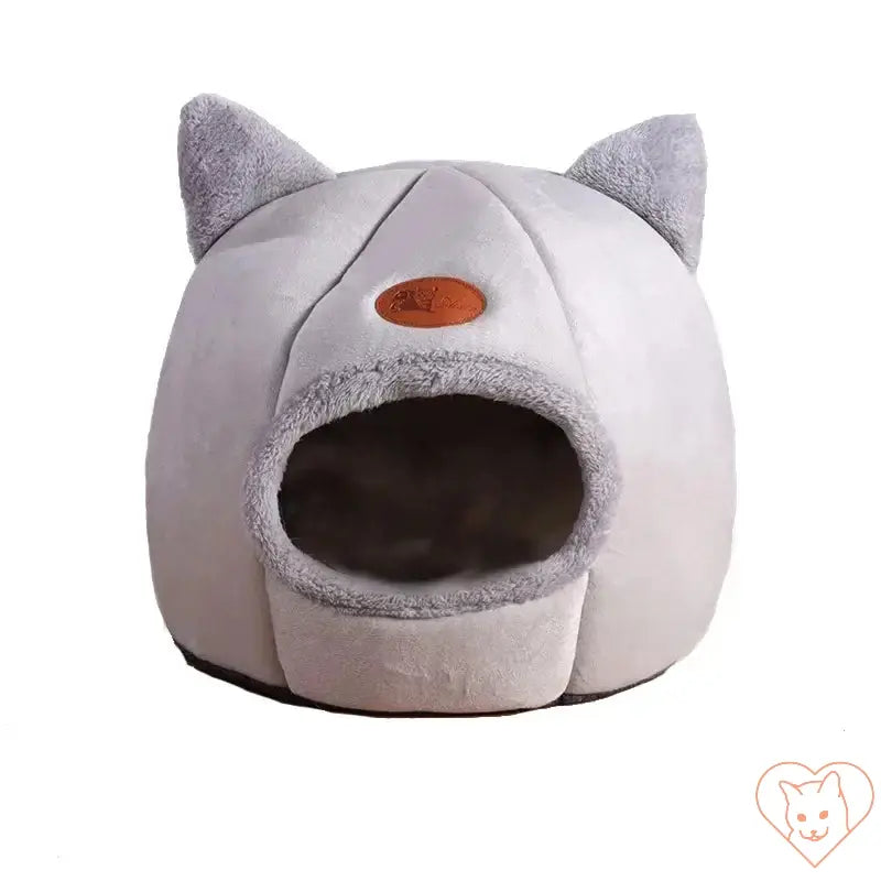 Cozy Winter Cat Cave Bed in soft grey fabric with ears, perfect for deep sleep and warmth for cats and small dogs.