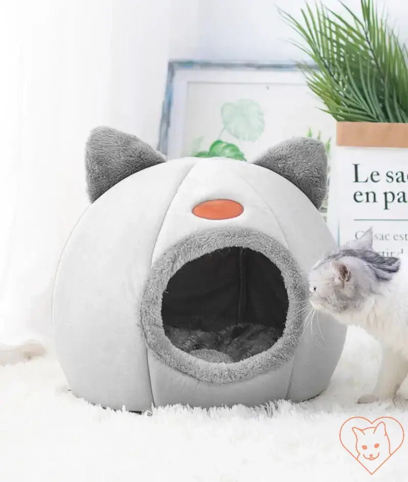 Cozy Winter Cat Cave Bed in gray with ears, perfect for pets to cuddle and sleep comfortably.