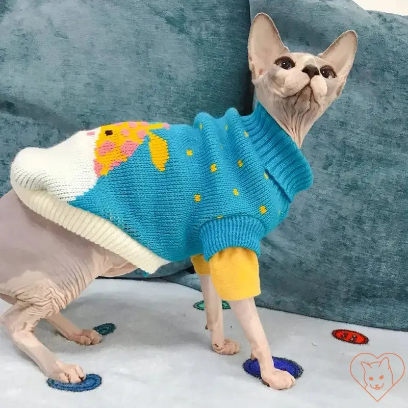 Sphynx cat wearing a colorful cartoon-patterned sweater, showcasing a cozy winter costume.