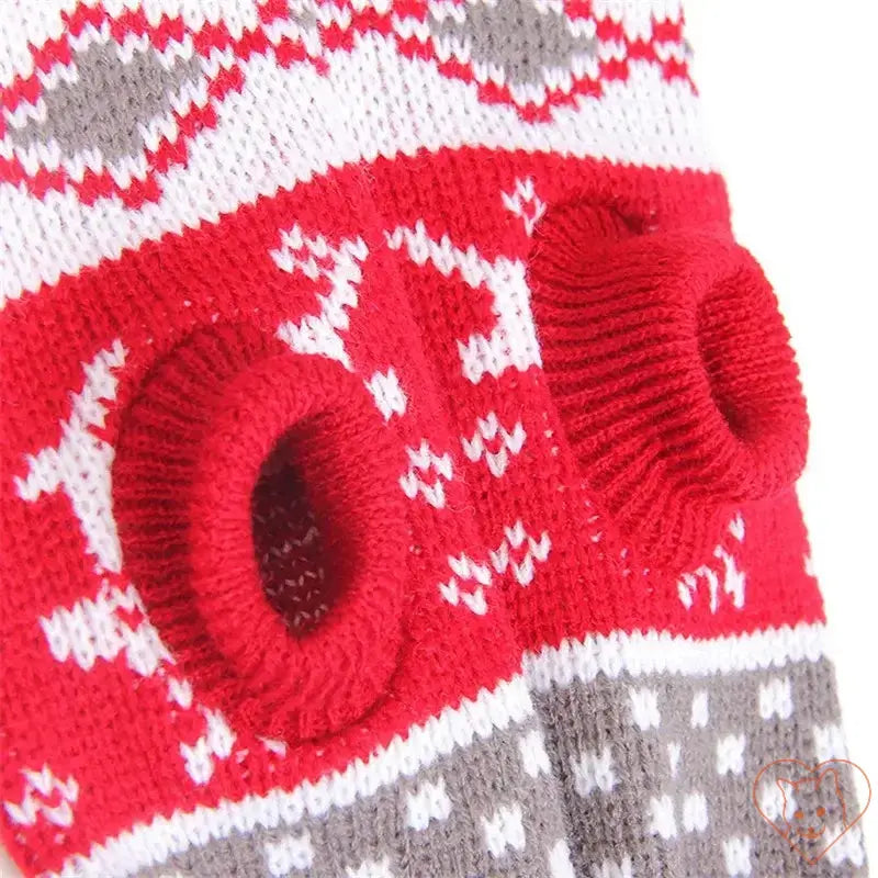 Close-up of a cute red and gray cat sweater featuring snug holes for the front legs, designed for warmth and style.