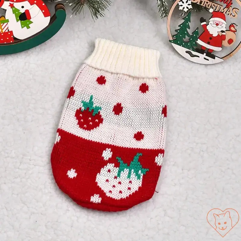 Cute knitted sweater costume for cats, featuring a festive strawberry design in red and white colors.