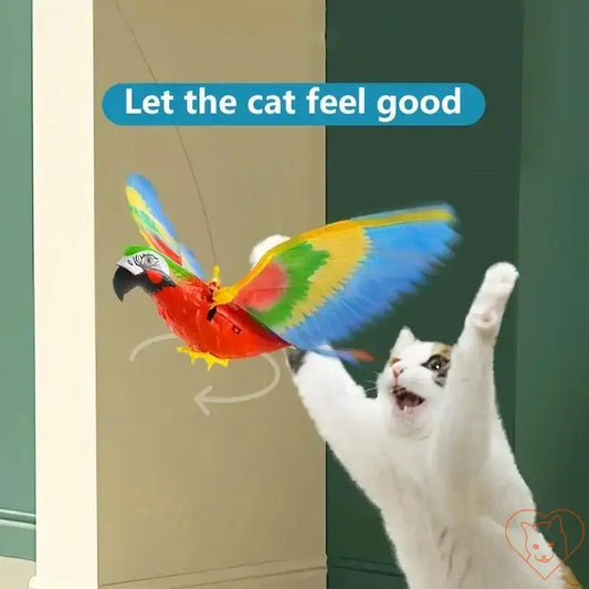 Cat joyfully playing with an electric hanging bird toy, simulating a flying bird for fun indoor entertainment.