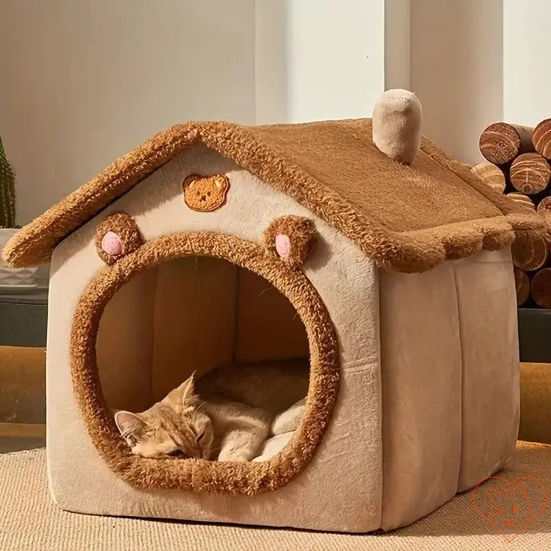 Cozy foldable cat bed resembling a pet house, featuring a soft interior and a sleeping cat inside the entrance.