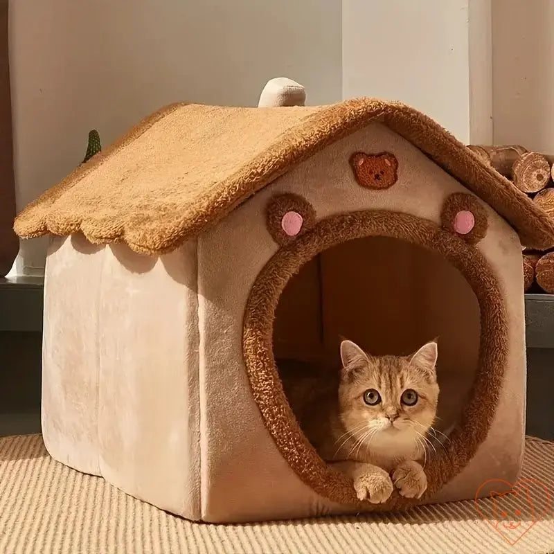 Cozy foldable cat bed shaped like a house, featuring a playful design and a cat peeking out from the entrance.